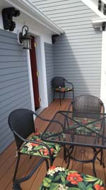 balcony with mesh table and chairs 